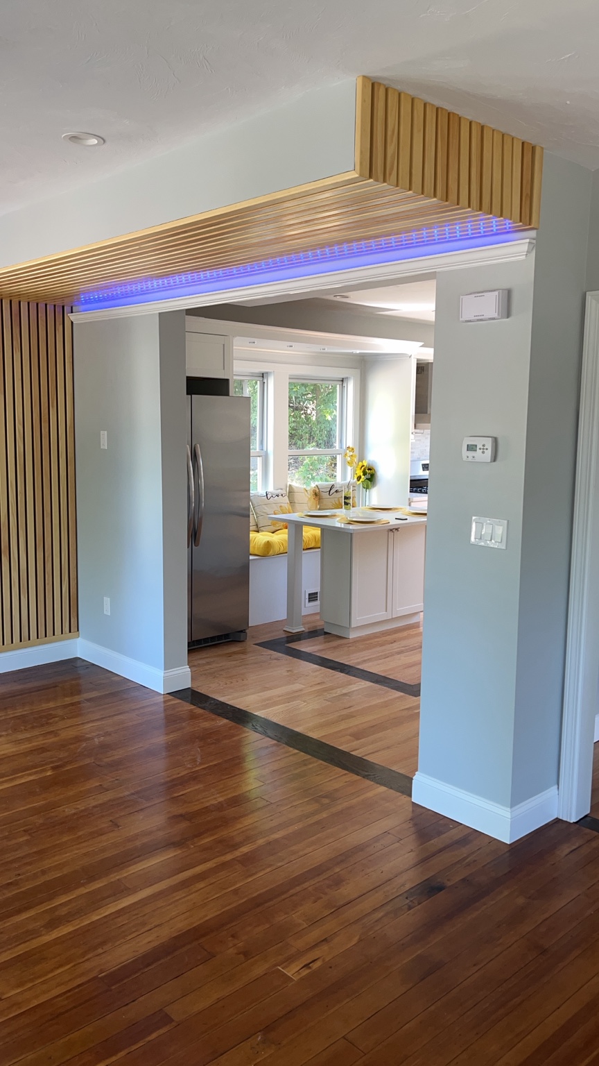 Finished interior remodel with hardwood floors and custom wood slat details